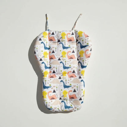 Coussin de chaise haute pour bébé motif dinosaures, à plat avec ses attaches