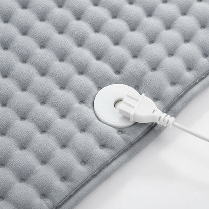 Velours doux du coussin chauffant et connecteur blanc de la commande amovible