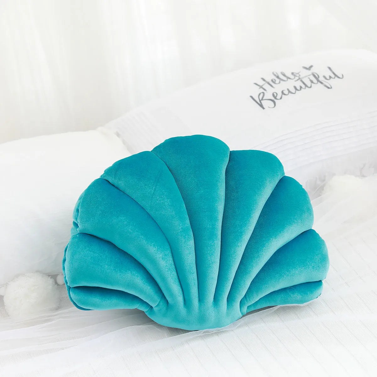 Coussin coquillage en velours, coloris turquoise