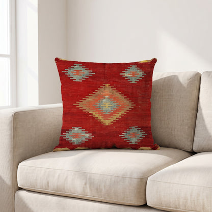 Coussin ethnique motif Symphonie Touarègue 45x45 cm posé sur un canapé en lin beige