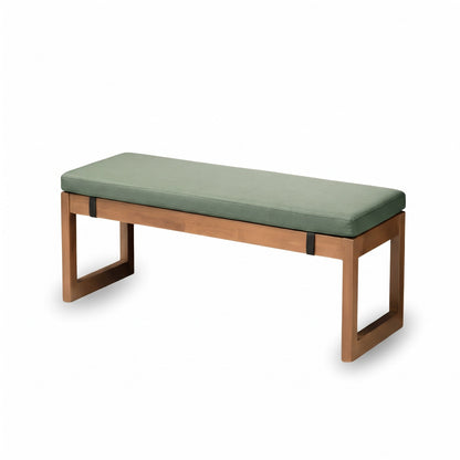 Coussin pour banc vert de 3 cm d'épaisseur sur un banc en bois