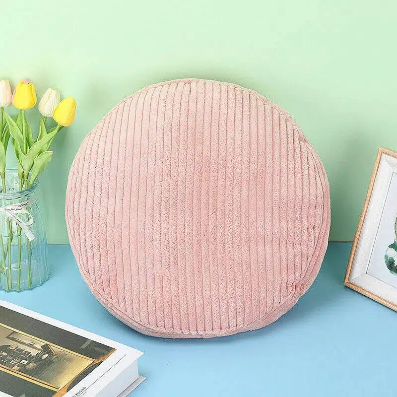 Coussin rond en velours côtelé rose