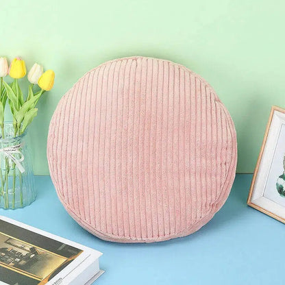 Coussin rond en velours côtelé rose