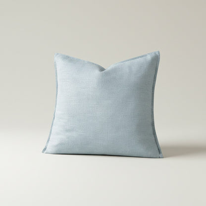 Housse de coussin bleu gris à bord plat, aspect toile lavée, vue de face