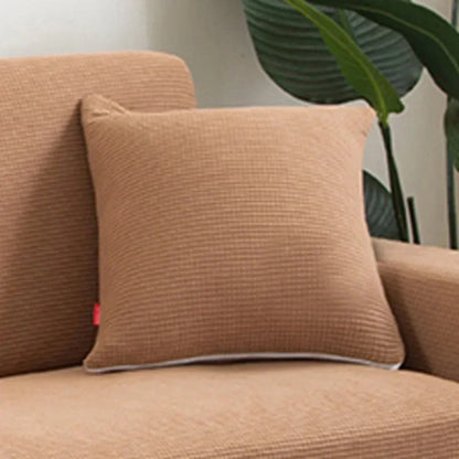 Coloris caramel de la housse de coussin en maille texturée