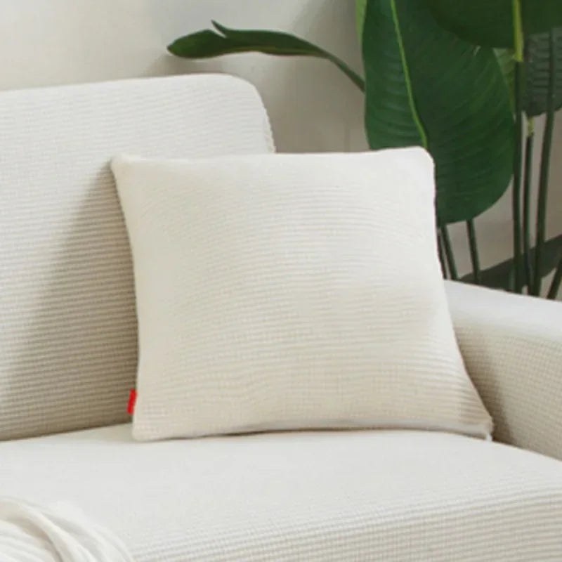 Coloris crème de la housse de coussin en maille texturée