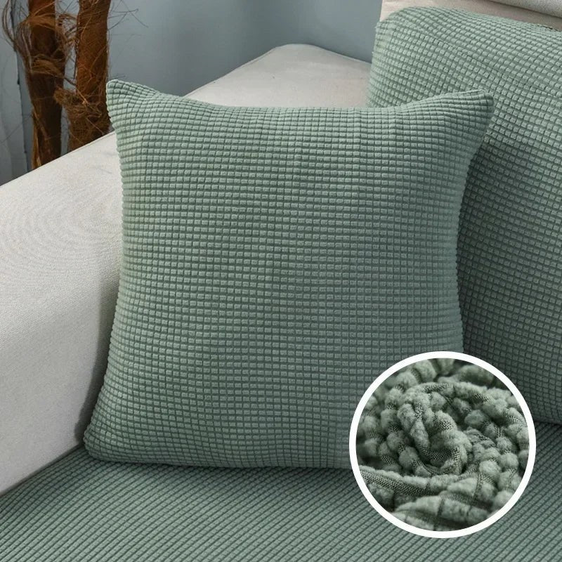 Coloris vert sauge de la housse de coussin en maille texturée