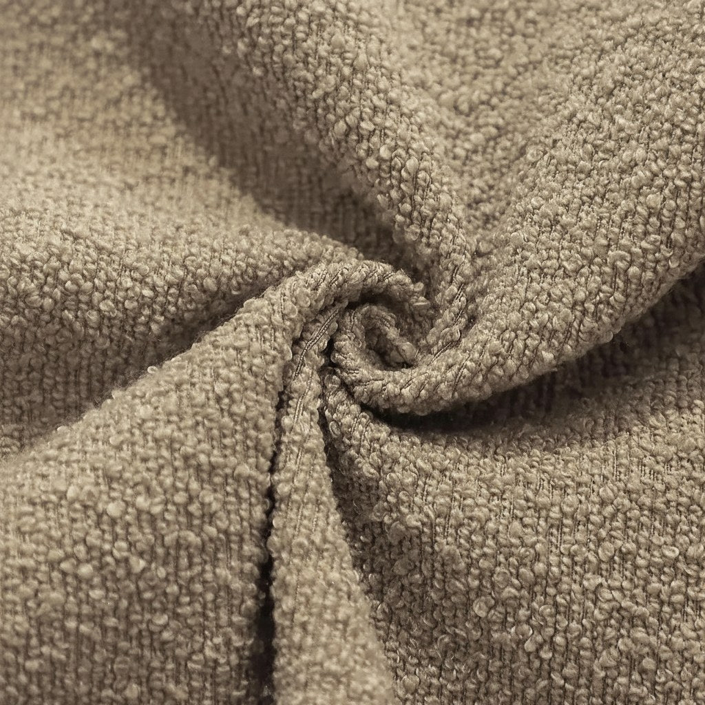 Détail du tissu bouclette d'une housse de coussin